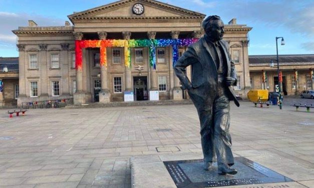 It’s behind you, Harold! Huddersfield Railway Station has been yarn-bombed for the WOVEN festival