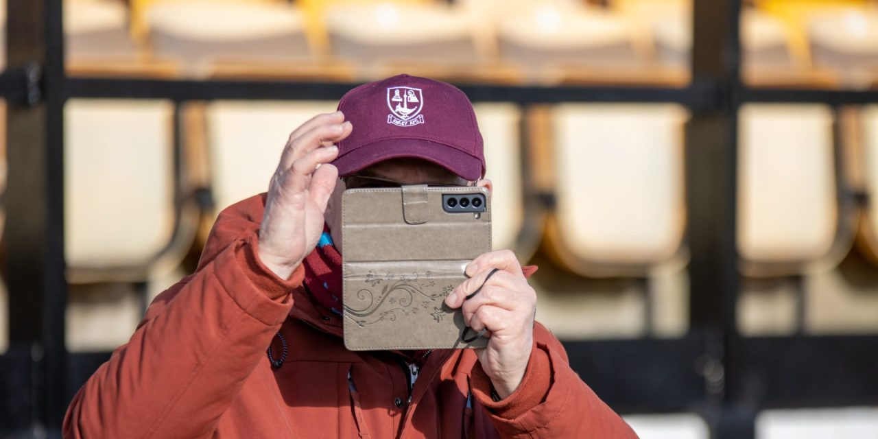 Fan Gallery: Our snapper is snapped by mystery man in a cap as fans raise a glass to Emley’s seventh win in eight matches