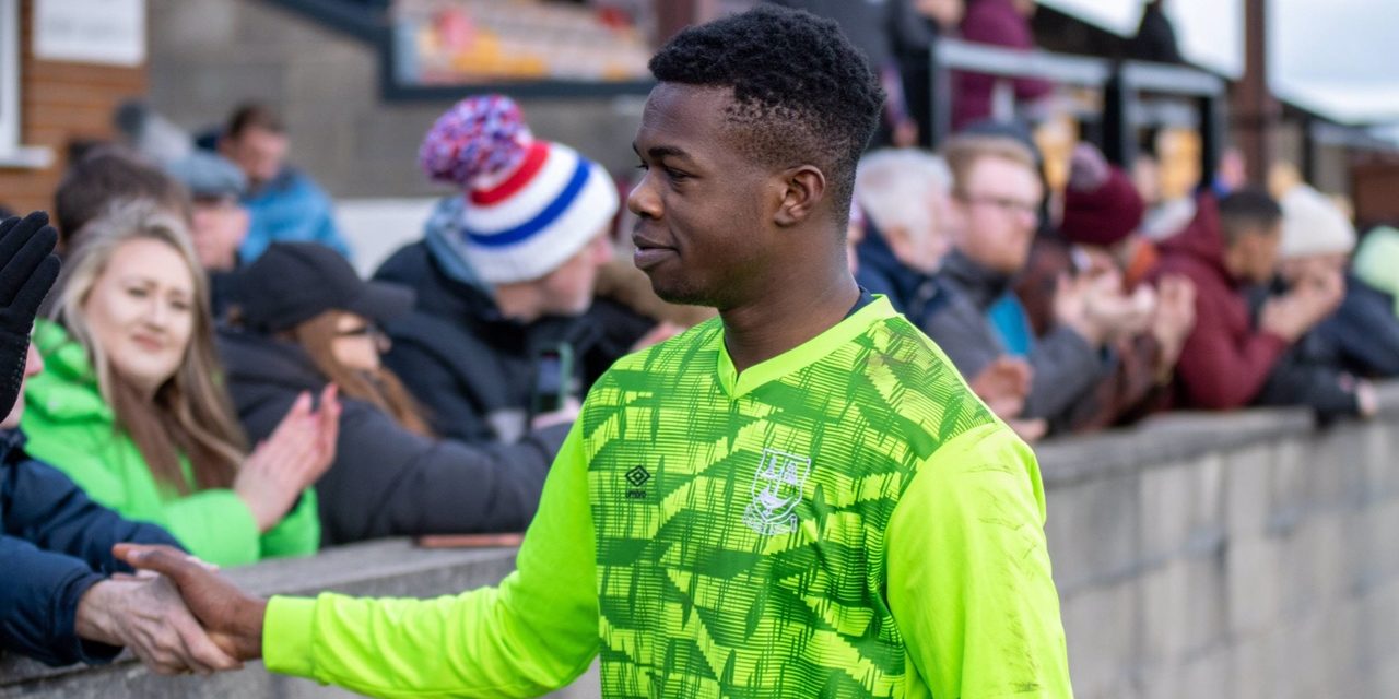 On-loan Huddersfield Town keeper Michael Acquah earns the plaudits as Emley AFC clinch seventh win in eight matches