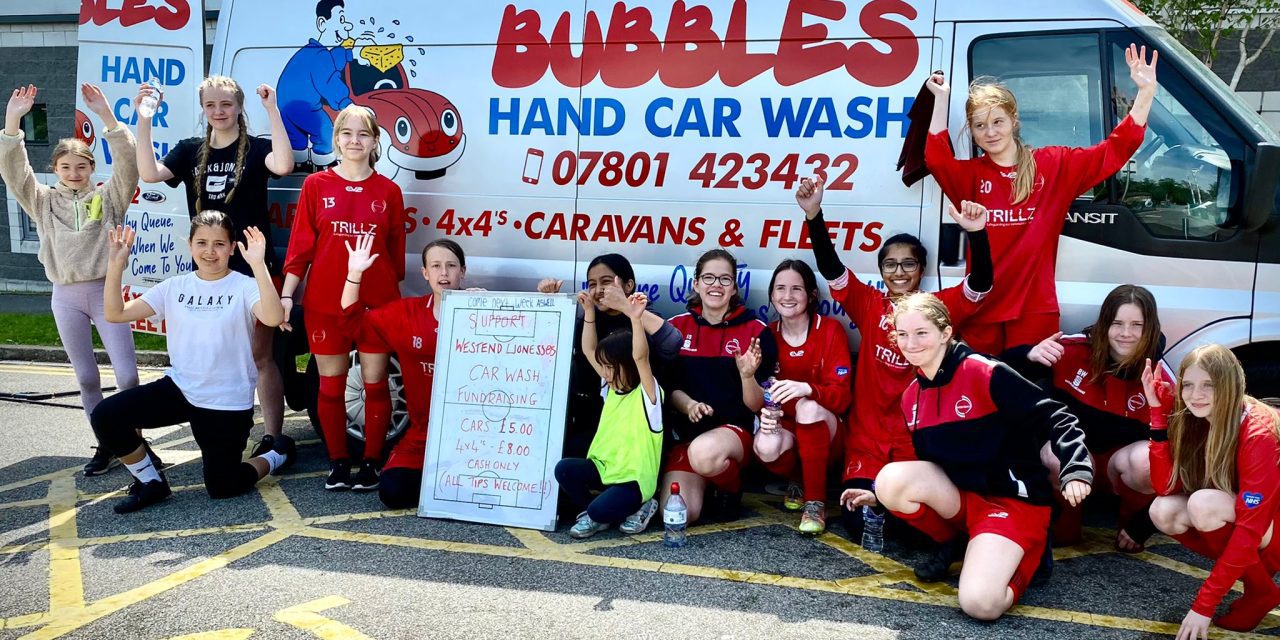 Young Lionesses from Westend Juniors raise £500 at car wash to help pay for trip to Old Trafford