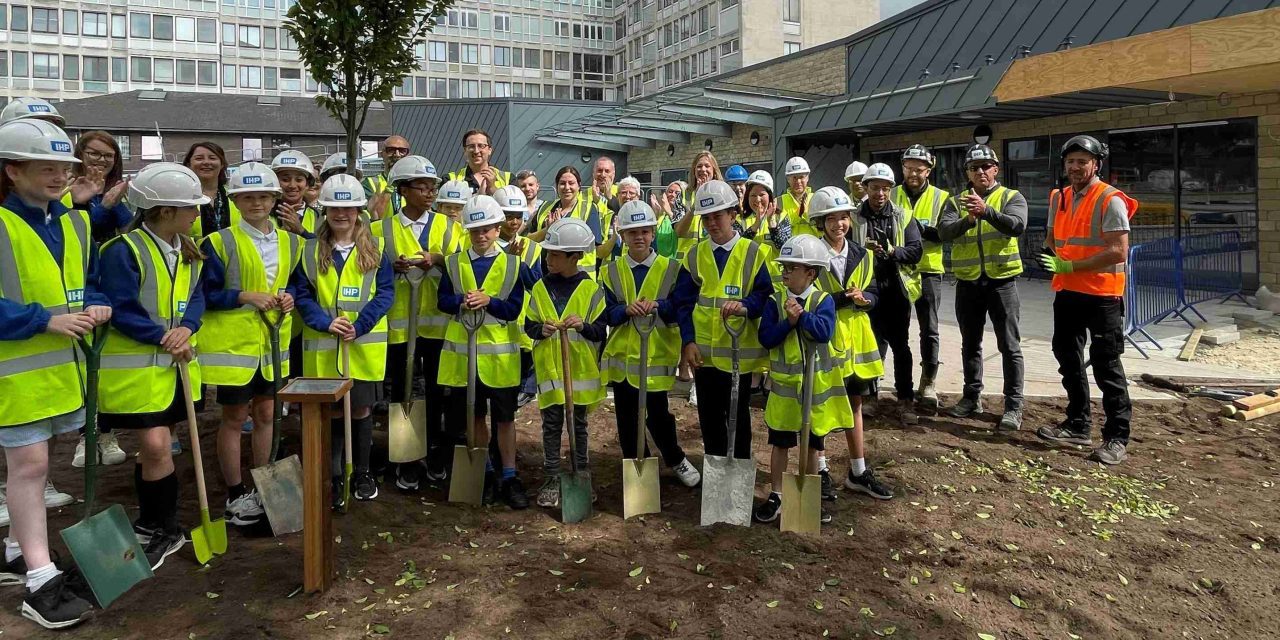 Children plant a tree at Huddersfield Royal Infirmary to help celebrate 75th anniversary of the NHS
