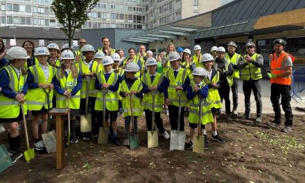 Children plant a tree at Huddersfield Royal Infirmary to help celebrate 75th anniversary of the NHS