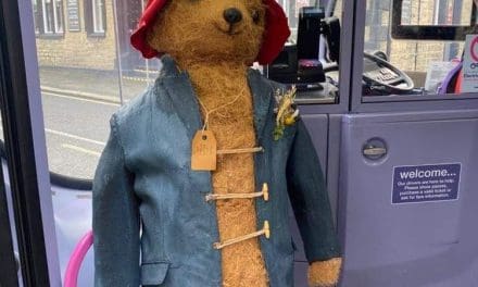 Paddington bear on his travels again as he arrives for Lindley Scarecrow Festival – on a bus