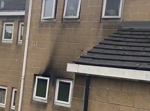 Man dies after suspected arson attack at Huddersfield flats where young family had to jump for their lives