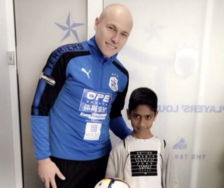 Huddersfield Town fan who touched the heart of Aaron Mooy immortalised in print as a superhero