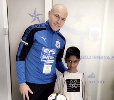 Huddersfield Town fan who touched the heart of Aaron Mooy immortalised in print as a superhero
