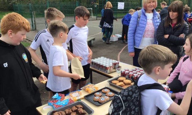 Youngsters cash in on business challenge and give most of their profits to charity