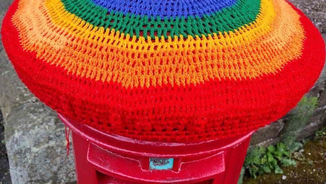 Colne Valley Yarn Banksy celebrates Pride and the life of Jo Cox MP with crocheted postbox toppers