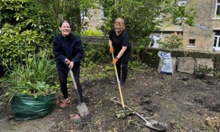 Staff from Ridley & Hall Solicitors dig in to help transform garden at Edgerton day centre