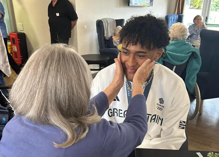 Our hero! Olympic silver medallist Caden Cunningham visits Lindley Grange Bupa Care Home