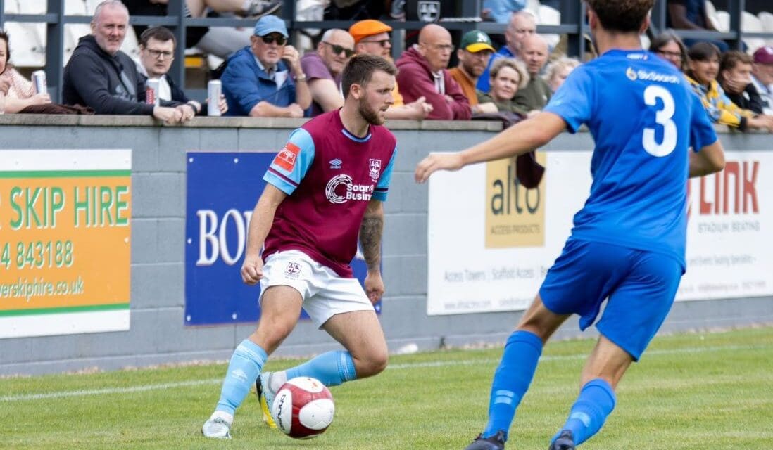 A Luke Parkin penalty keeps high-flying Emley AFC top of the table despite sending off