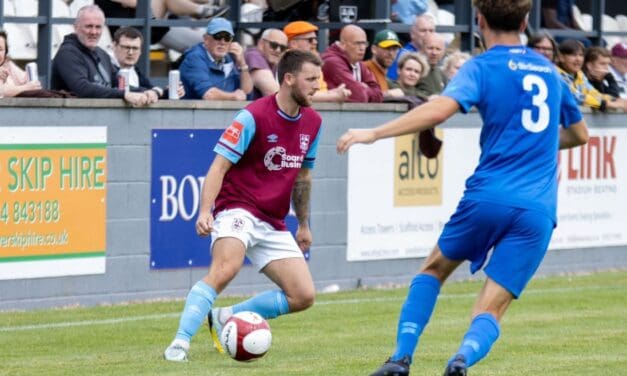 A Luke Parkin penalty keeps high-flying Emley AFC top of the table despite sending off